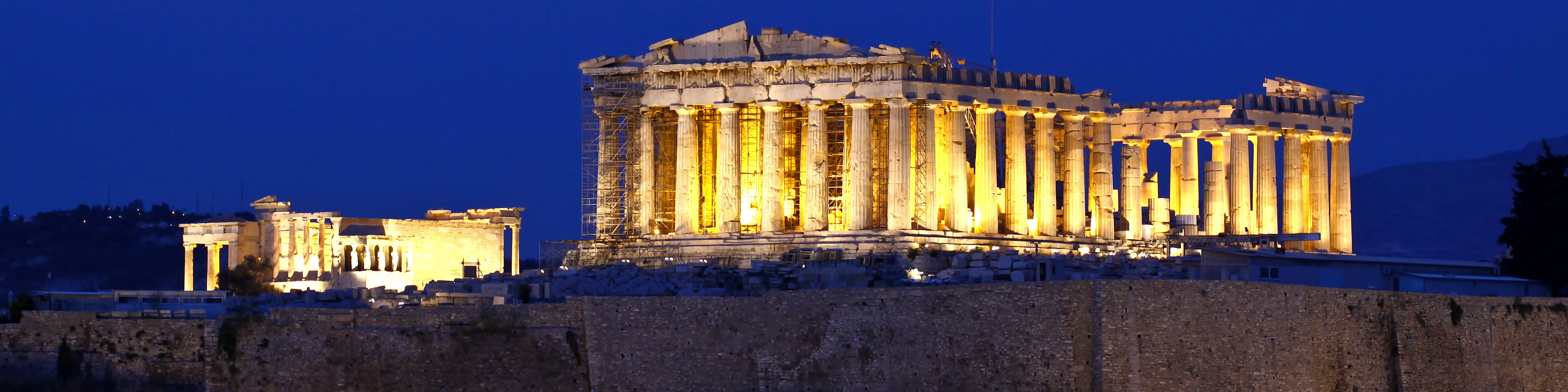 The Acropolis in Athens, Greece - a UNESCO World Heritage Site featuring ancient ruins and monuments such as the Parthenon and the Propylaea.