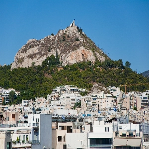 Mount Lycabettus in Athens, Greece - a hill offering panoramic views of Athens and the Aegean Sea, accessible by foot or cable car, and known for its stunning sunset vistas.