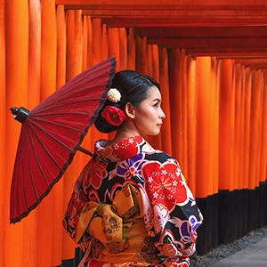 Fushimi Inari Shrine in Kyoto, Japan - a famous Shinto shrine with thousands of vermilion torii gates forming a stunning pathway up the mountain.